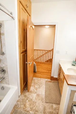 Full-height wood cabinetry providing ample storage