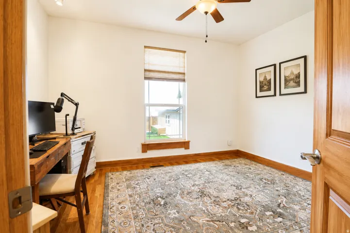 Bright room with wood-finish flooring and white walls