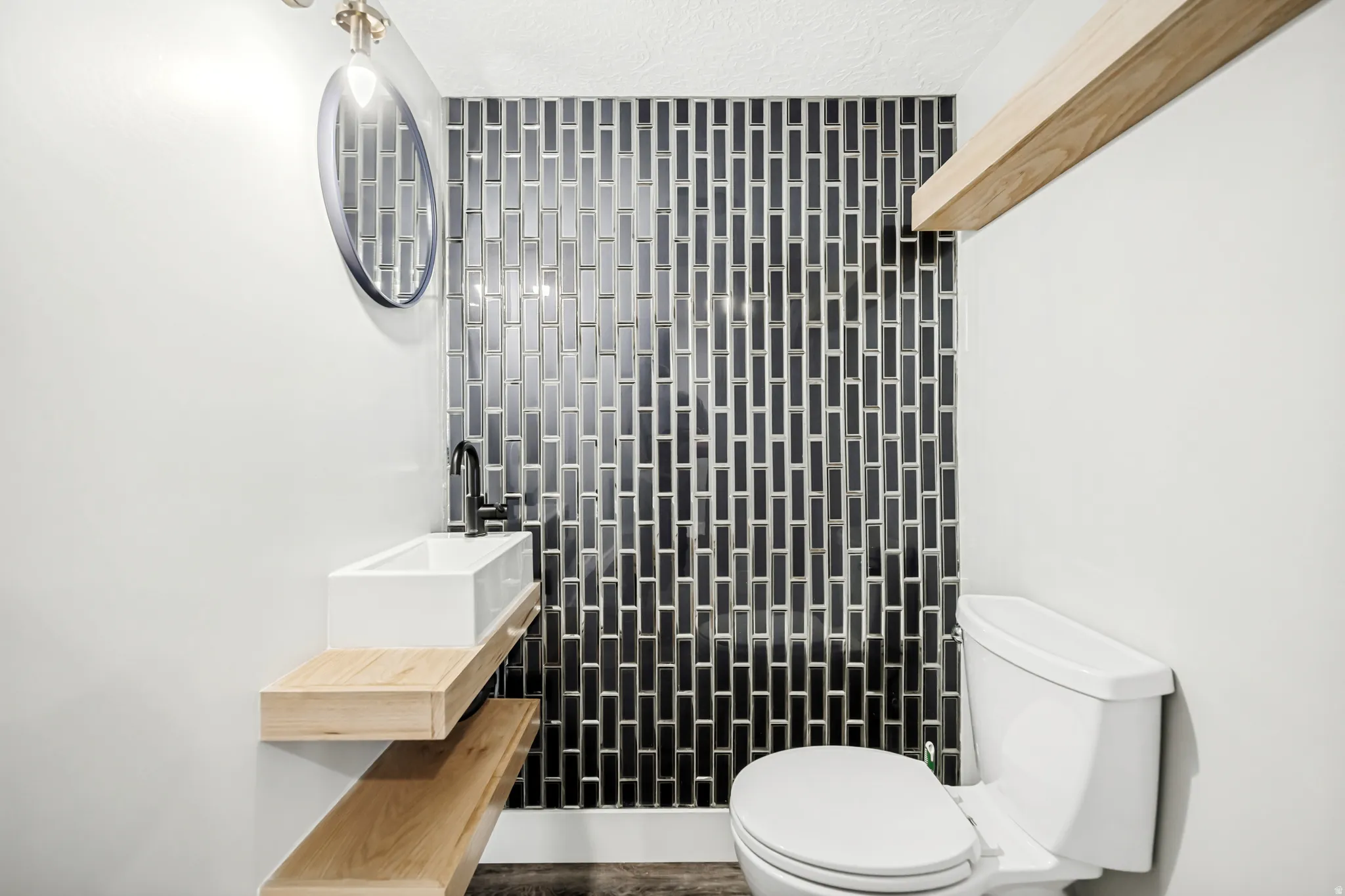 Half bath with vanity and toilet