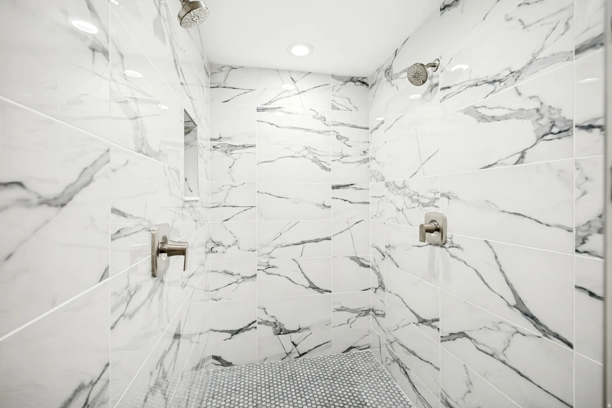 Full bathroom featuring a marble finish shower