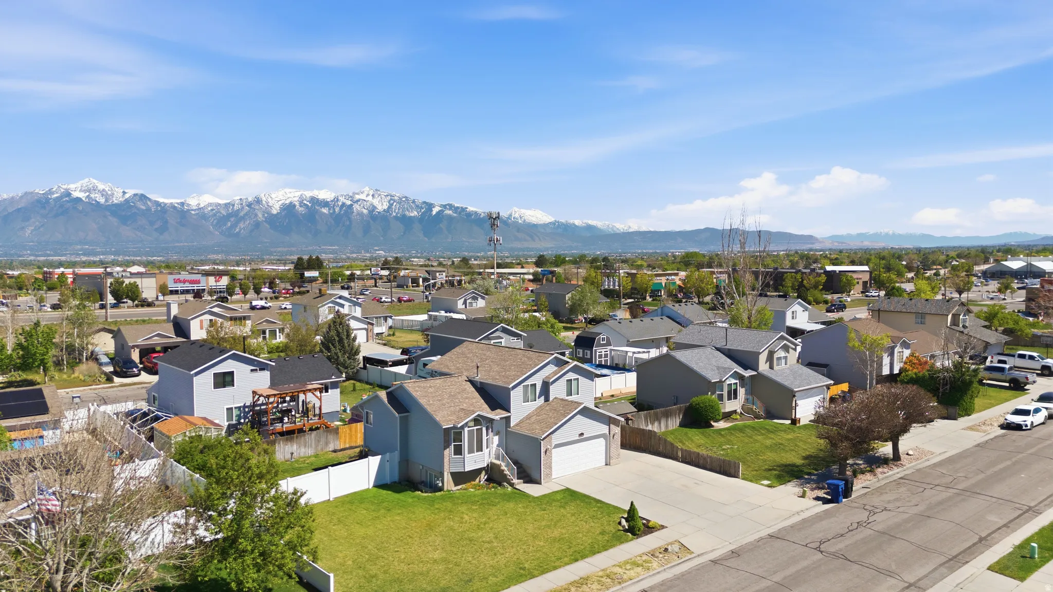 Aerial view of residential area featuring a mountain backdrop