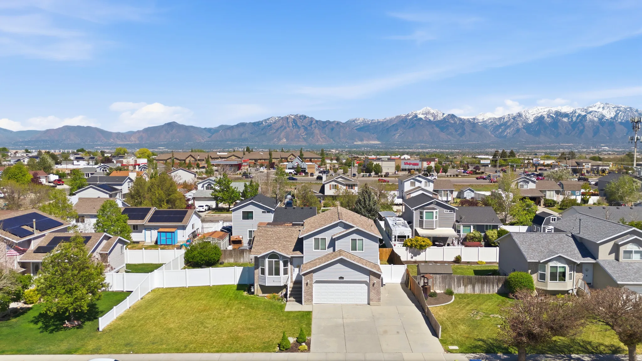 Aerial view of residential area with a mountainous background