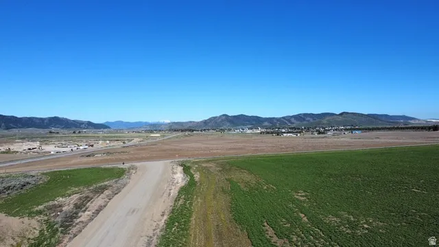 View of mountain backdrop with rural landscape