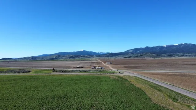 View of mountain backdrop with rural landscape