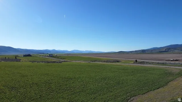View of mountain background featuring rural landscape