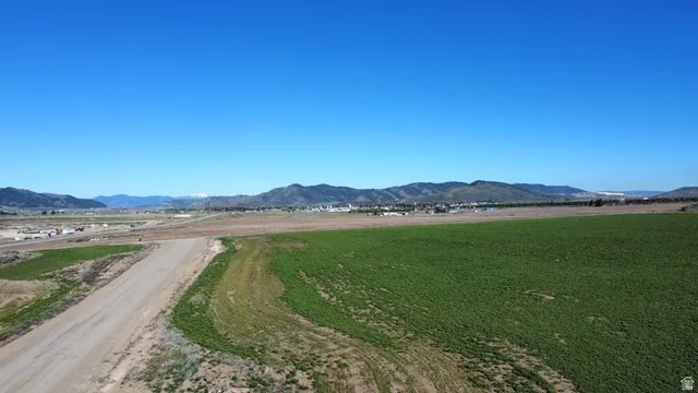 View of mountain backdrop featuring rural landscape