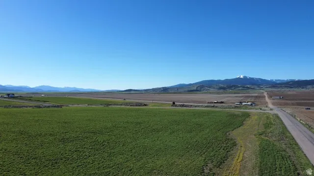 View of mountain backdrop featuring rural landscape