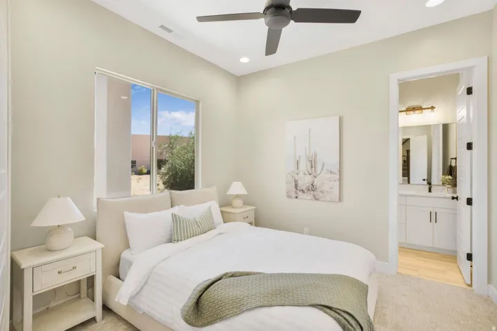 Bedroom featuring light colored carpet, a ceiling fan, and recessed lighting
