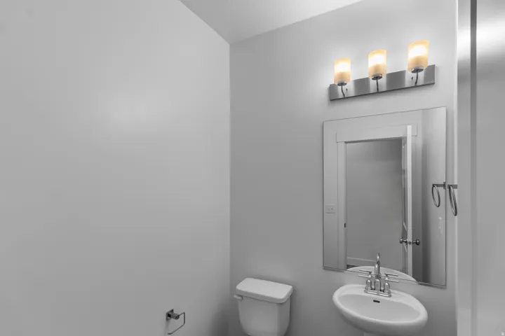 Half bath with toilet and a sink
