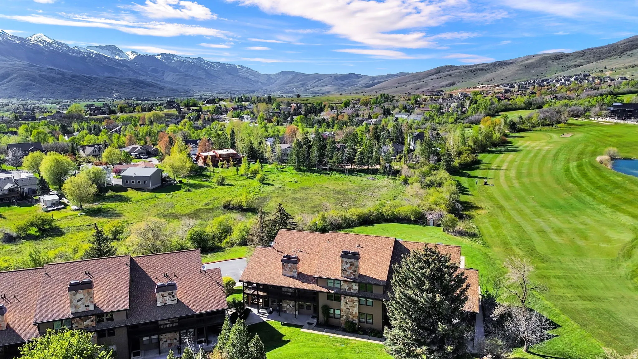 Building 4 with aerial views of the course and mountains