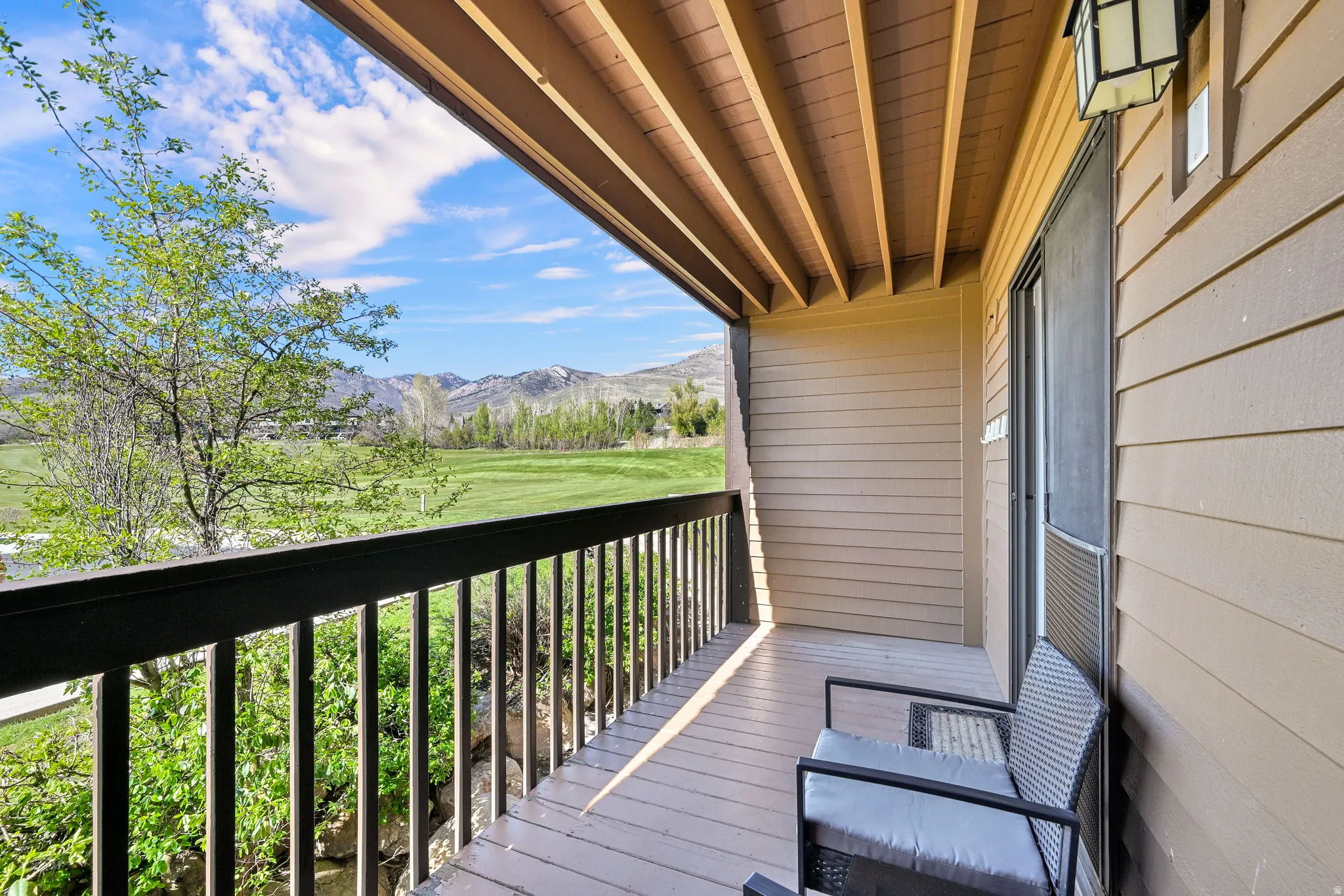 Balcony with mountain and golf course views