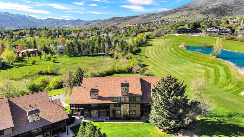 Building 4 with aerial views of the course and mountains