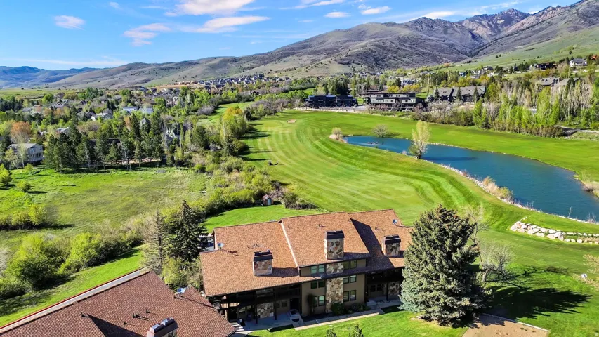 Building 4 with aerial views of the course and mountains