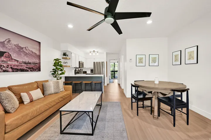 Living room with modern finishes, fireplace, eat-in kitchen, LVP flooring through-out main level.