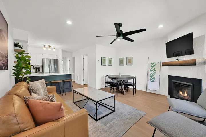 Living room with modern finishes, fireplace, eat-in kitchen, LVP flooring through-out main level.