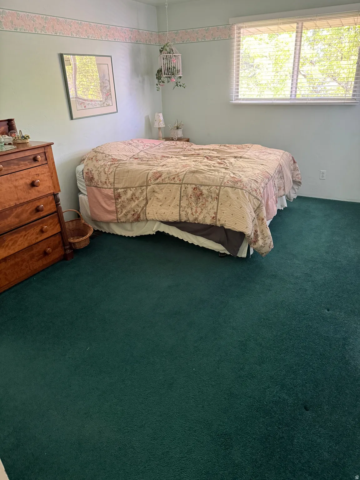Bedroom featuring dark carpet
