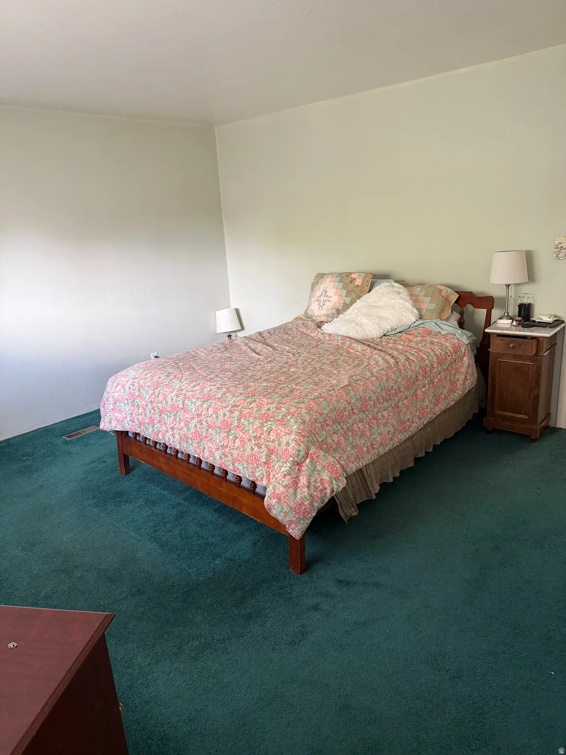 Bedroom with dark carpet