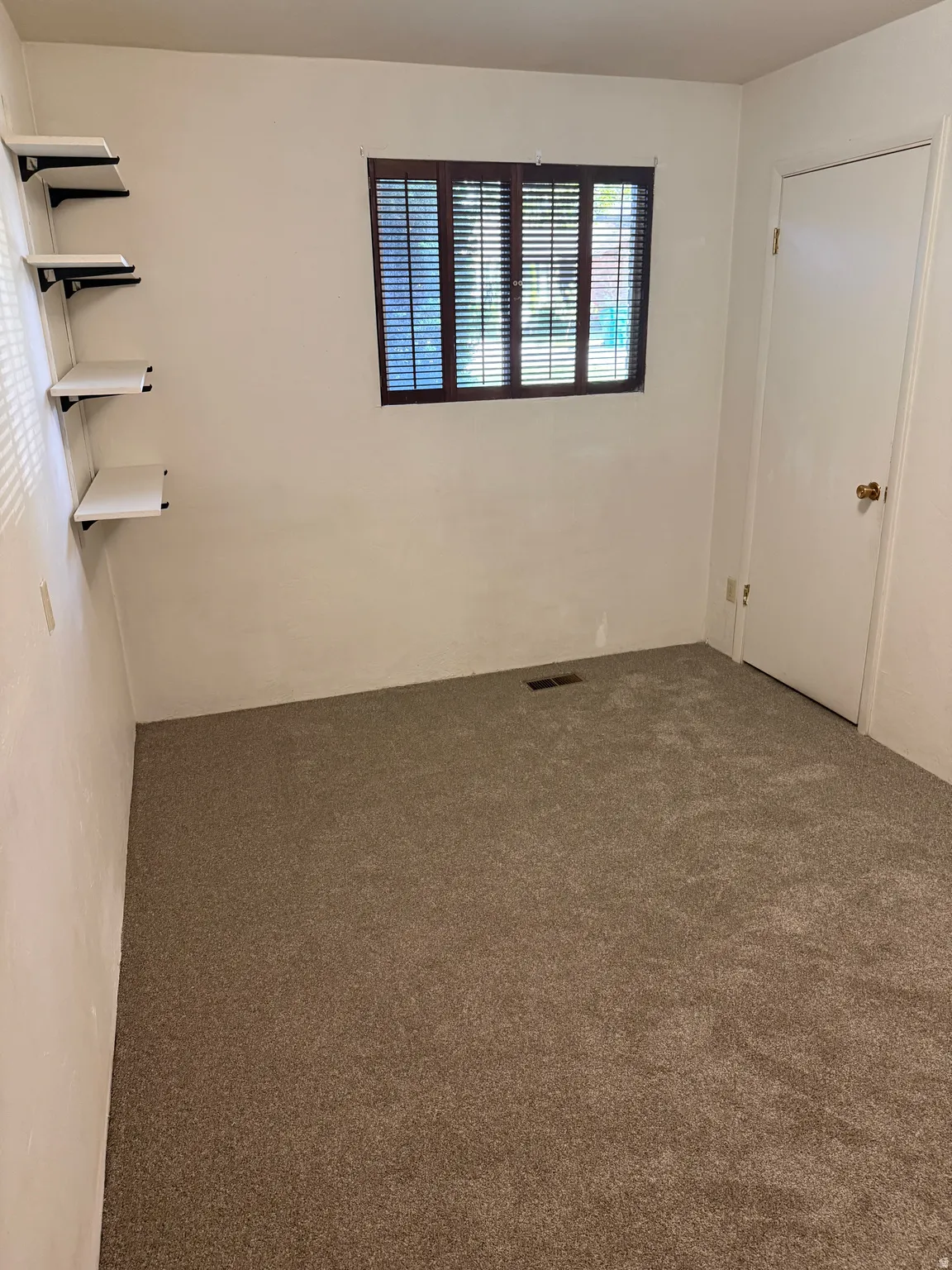 Unfurnished bedroom with carpet floors