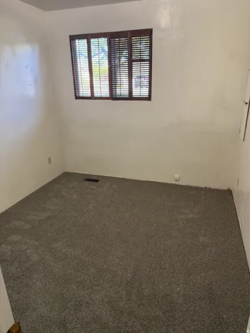 Spare room with carpet floors