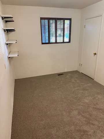 Unfurnished bedroom with carpet floors