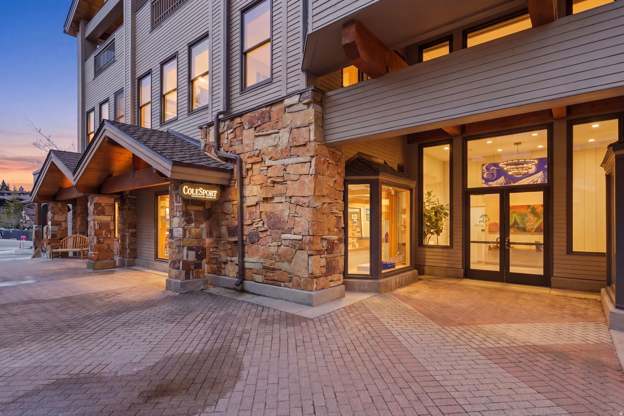 Multi-level building with stone and horizontal siding exterior