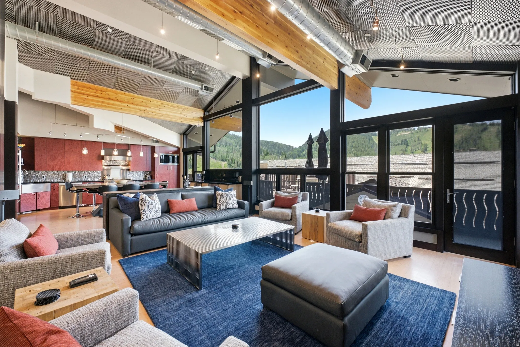 Vaulted ceilings with exposed beams and ductwork