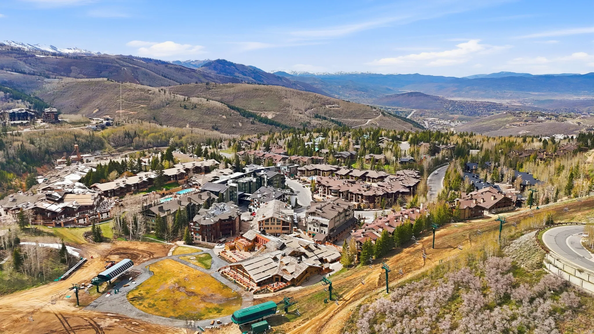 Expansive mountain landscape featuring a vibrant community of residential properties