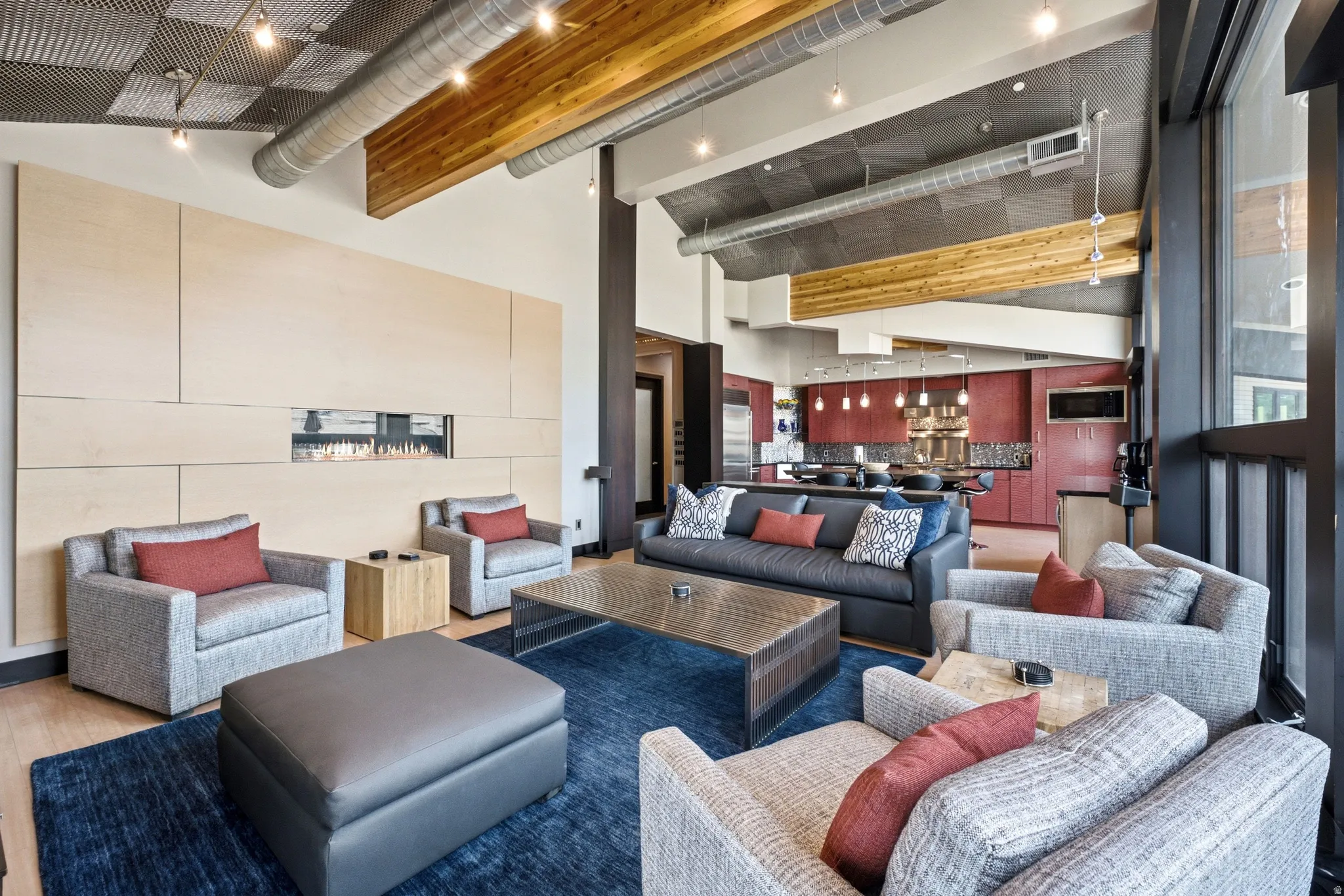 Open-concept living area with a contemporary fireplace feature wall