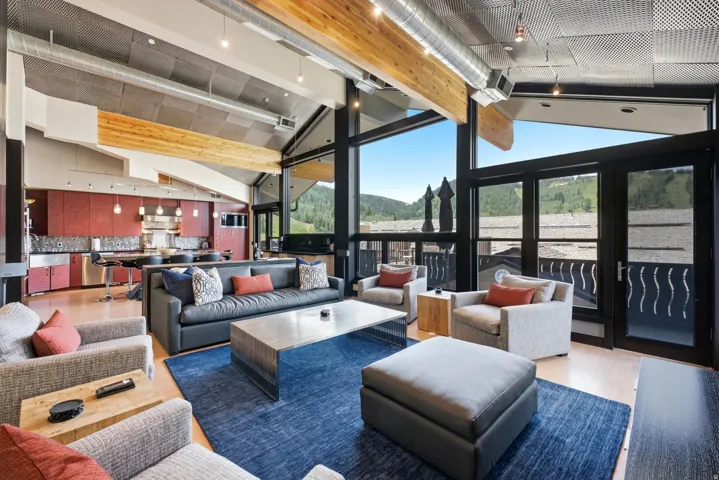 Vaulted ceilings with exposed beams and ductwork