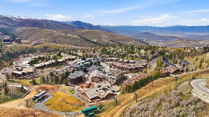 Expansive mountain landscape featuring a vibrant community of residential properties