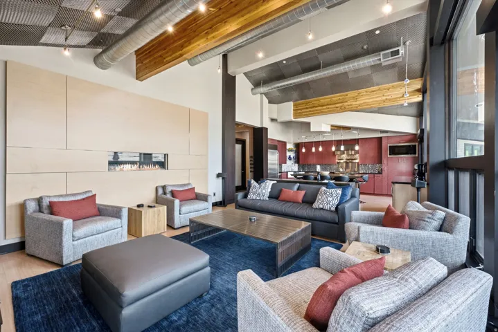 Open-concept living area with a contemporary fireplace feature wall