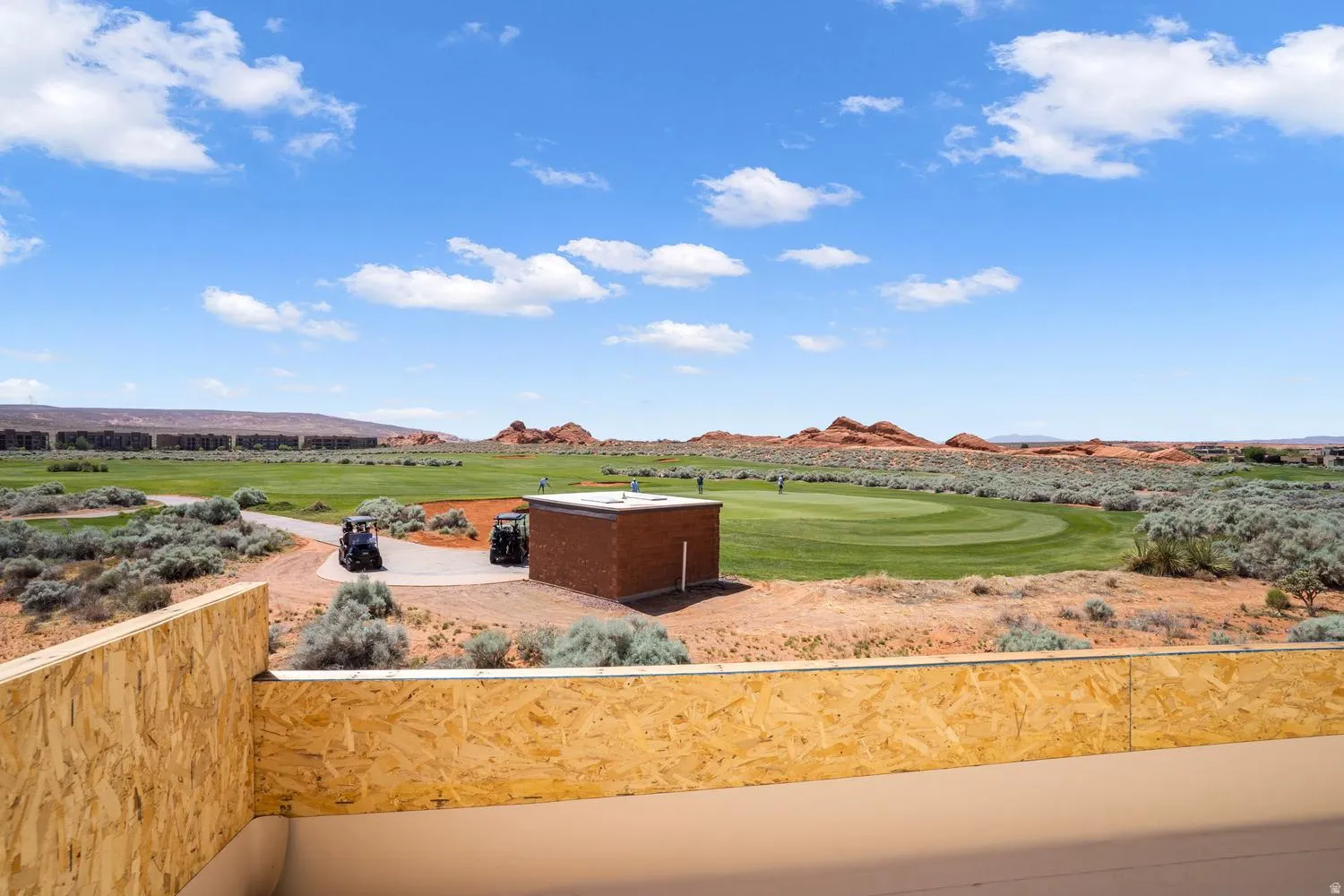 View of yard with a mountain view, golf course view, and a balcony