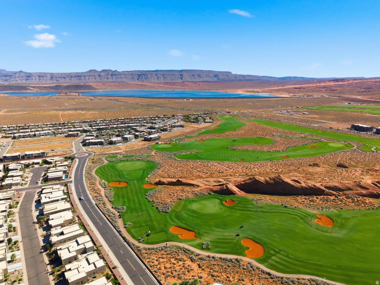 Bird's eye view of a water and mountain view and a golf club