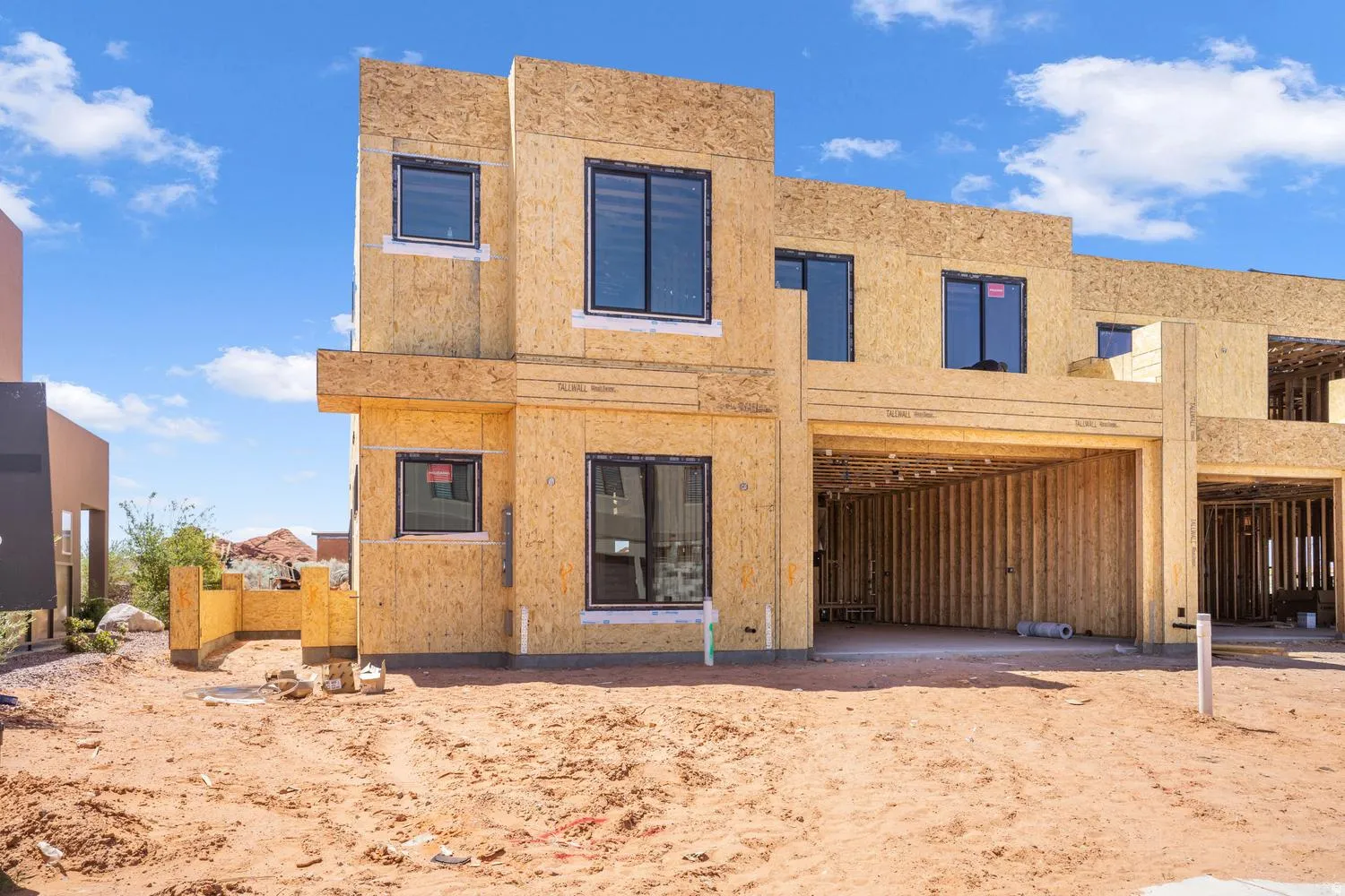 Back of property featuring stucco siding