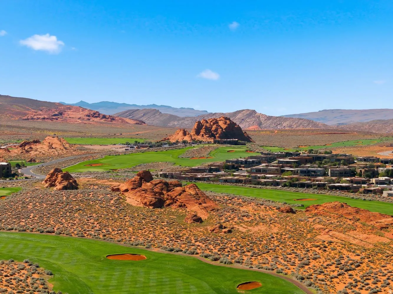 View of mountain backdrop with a golf course
