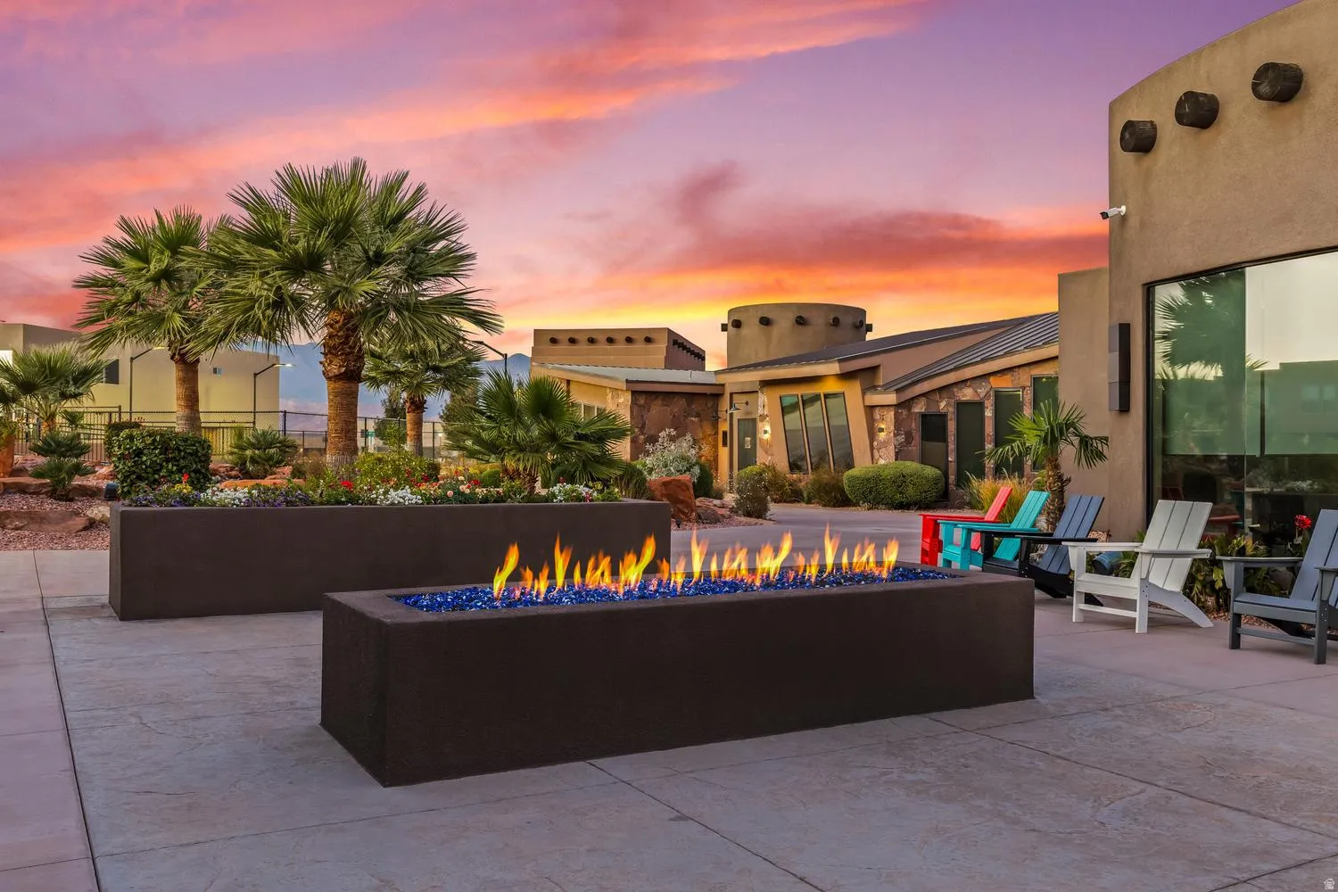 Patio terrace at dusk featuring a fire pit and a patio