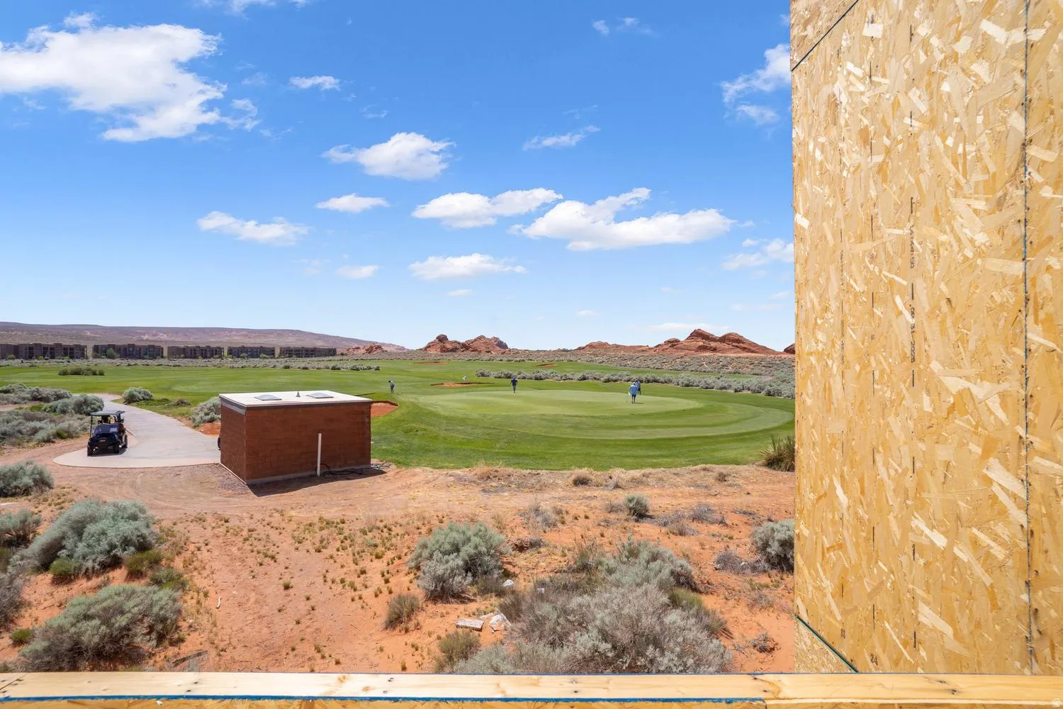 View of yard with a mountain view and view of golf course