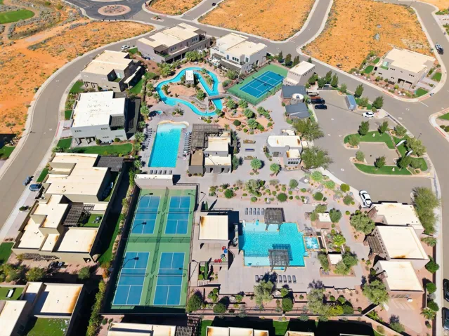 Aerial view of property and surrounding area with a pool area