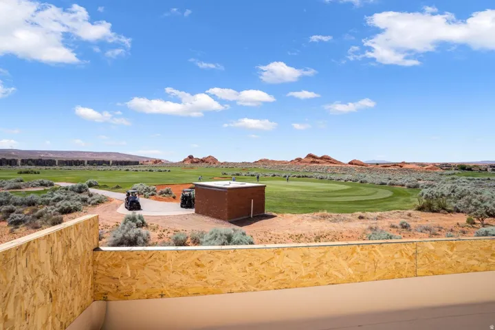 View of yard with a mountain view, golf course view, and a balcony