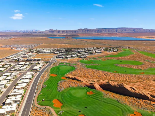 Aerial perspective of suburban area featuring a water and mountain view and a golf course