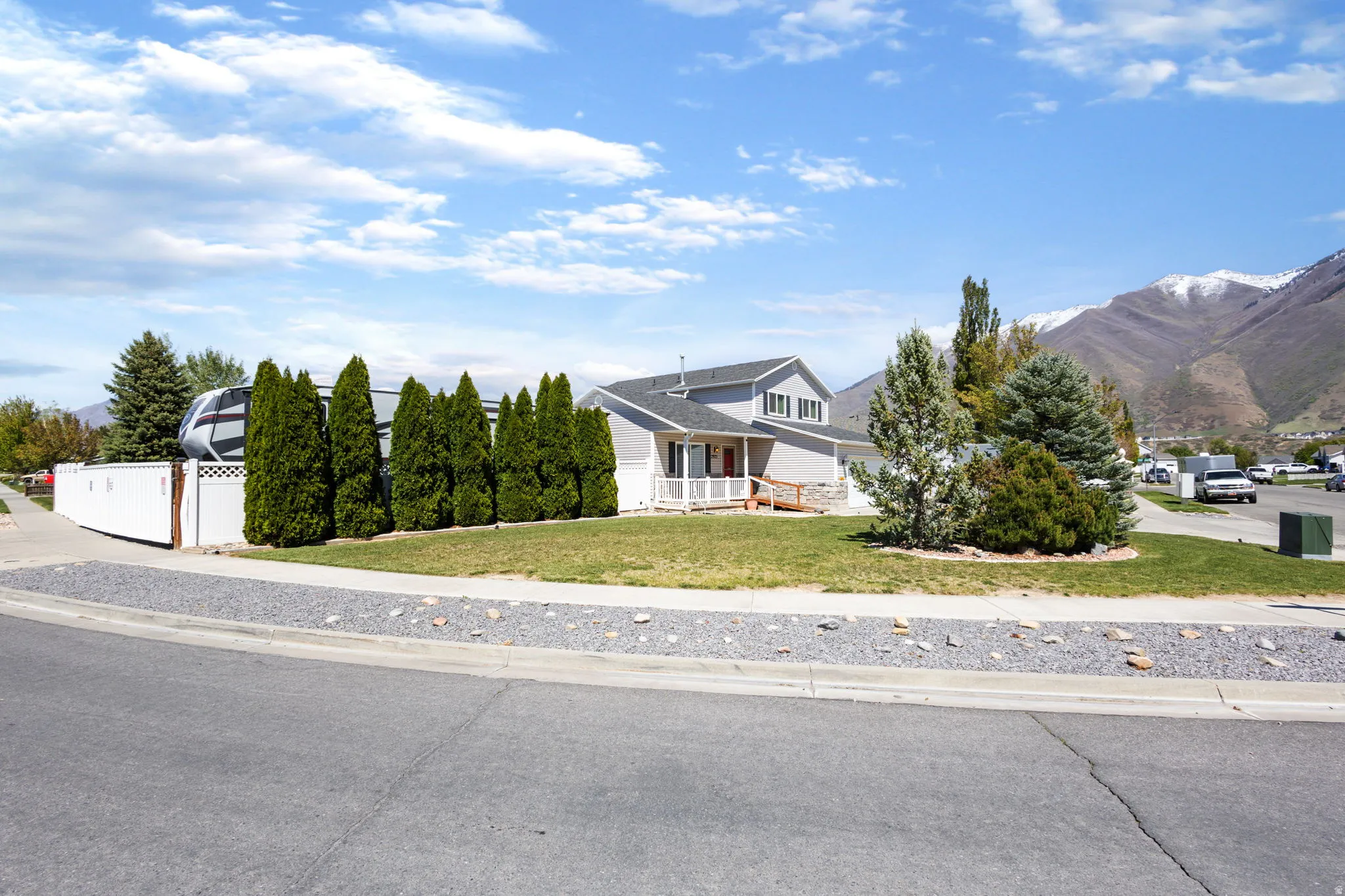 View of front of house featuring covered porch and a mountain view