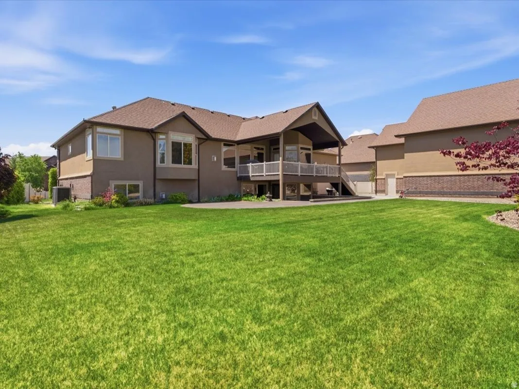 Expansive lawn with mature landscaping