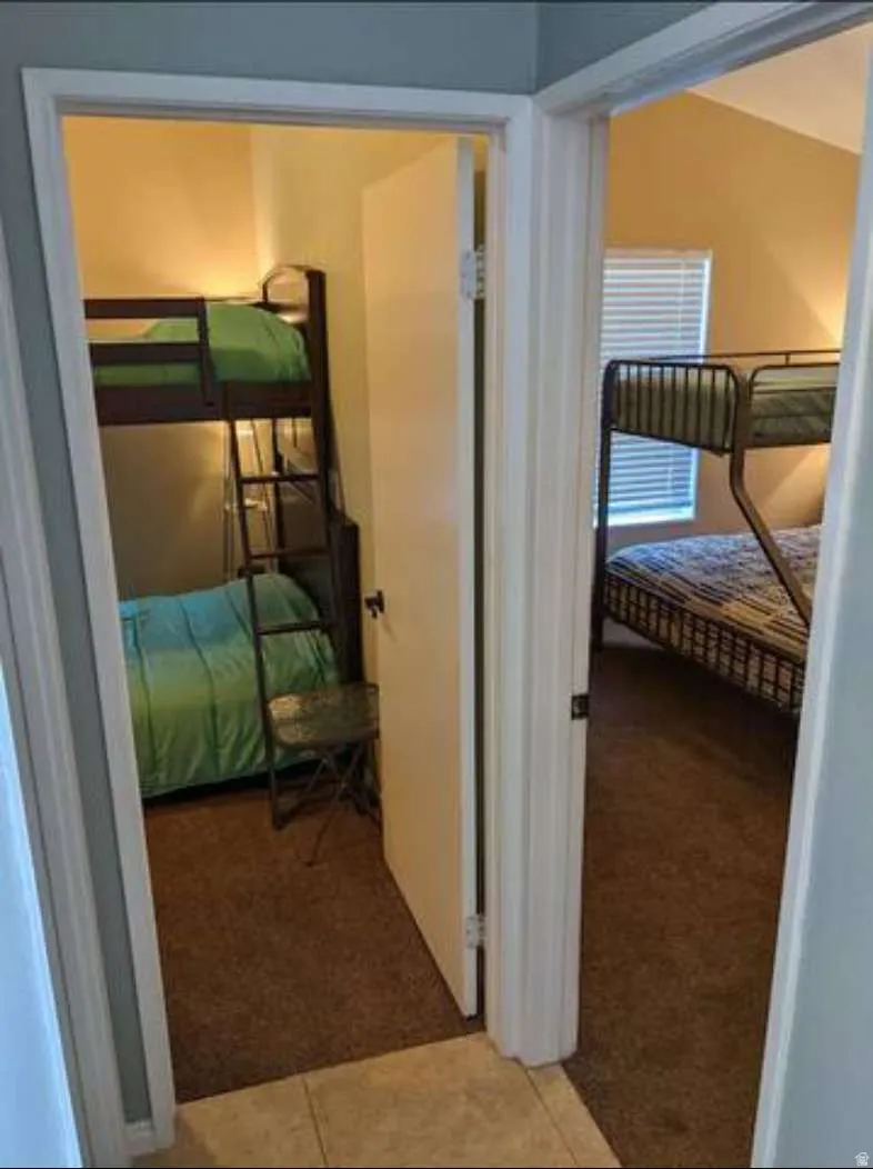 Hall with light colored carpet