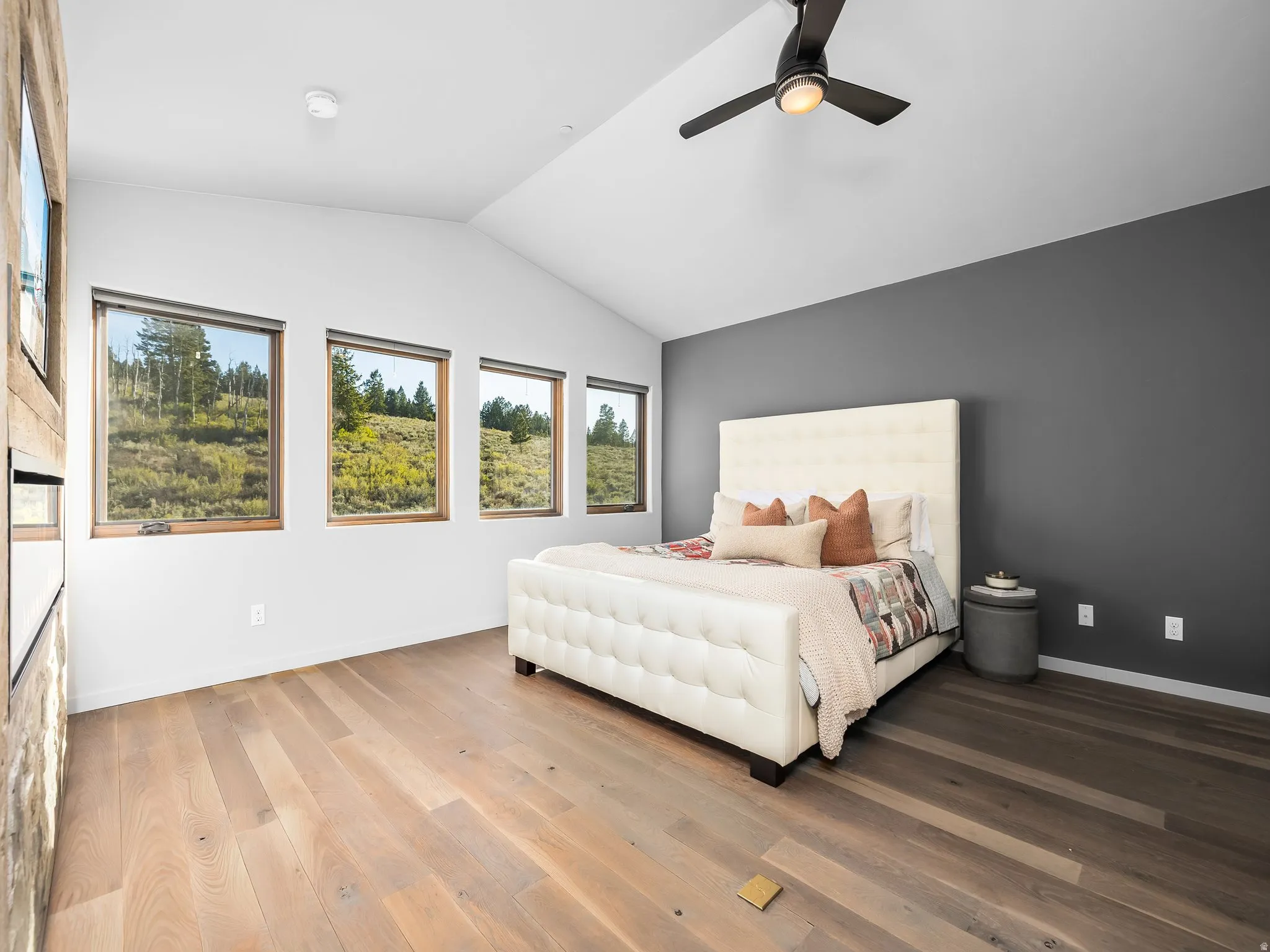 Bedroom with light wood-style flooring and ceiling fan