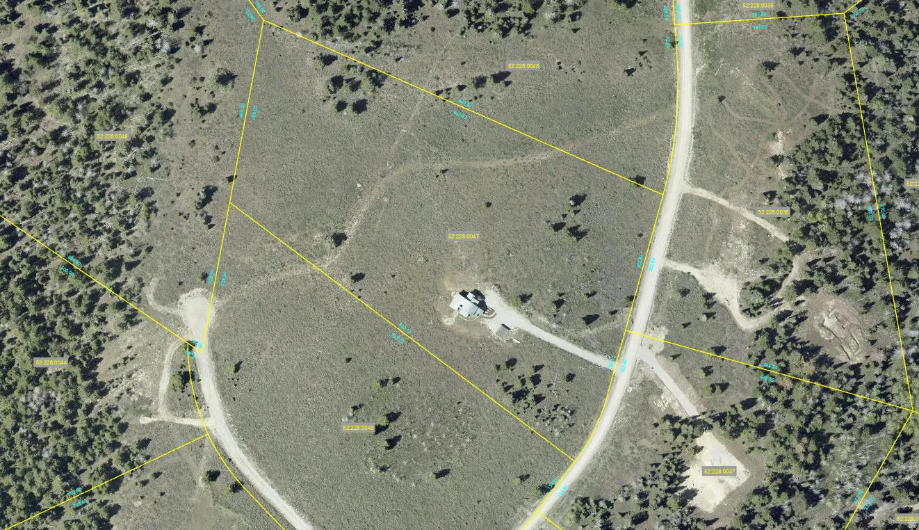 Aerial map of property and surrounding area with property parcel outlined