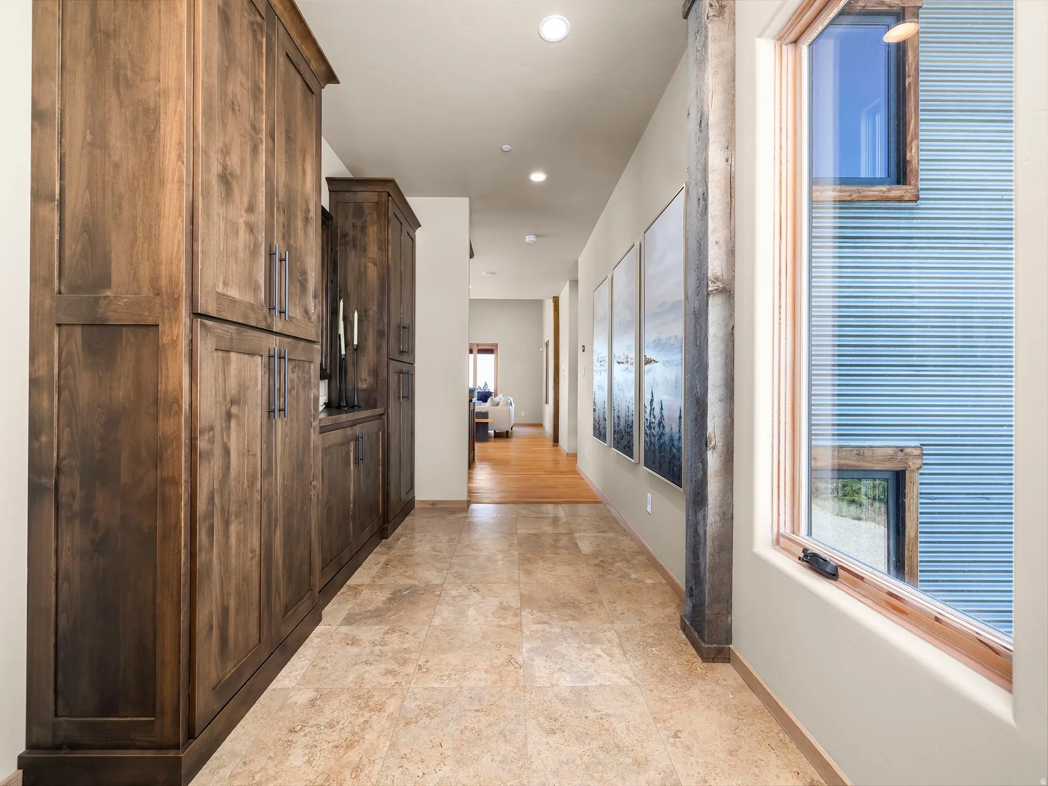 Hall with baseboards and recessed lighting