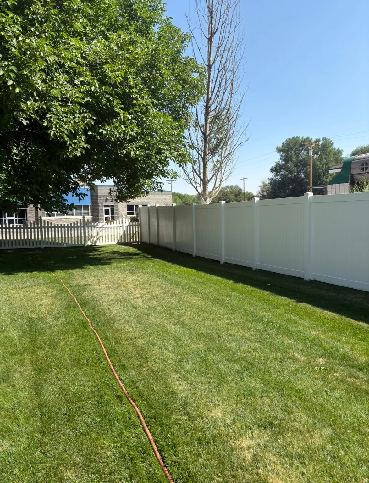 View of fenced backyard