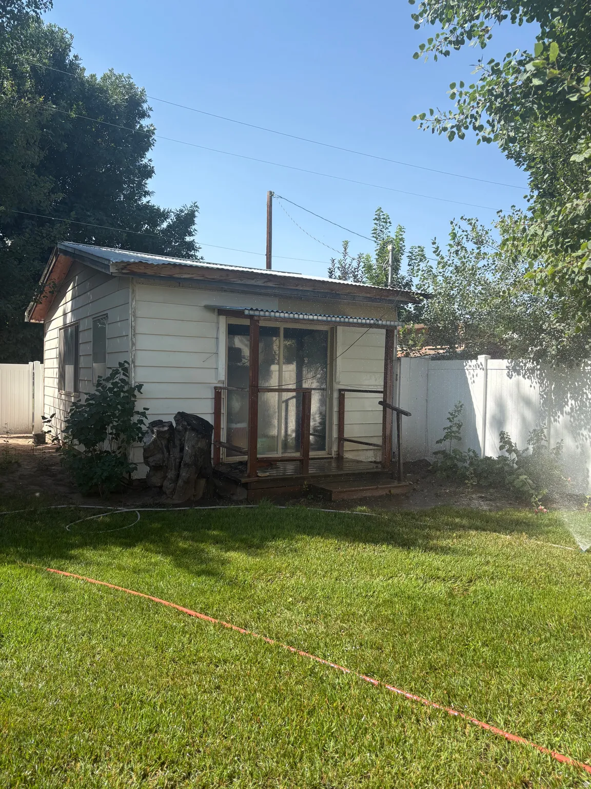 Back of property featuring a fenced backyard