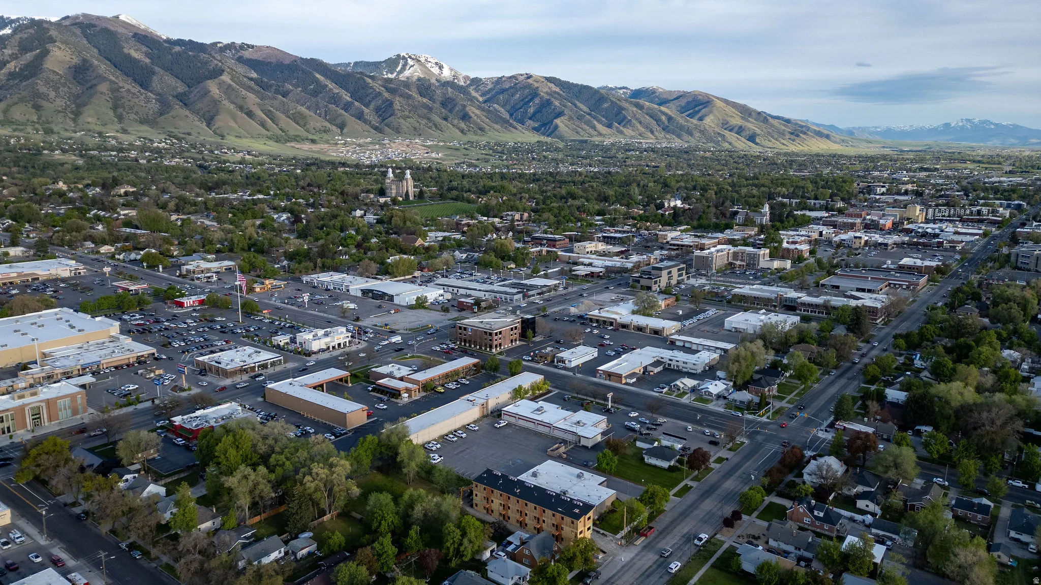 Aerial overview of property's location featuring a mountainous background