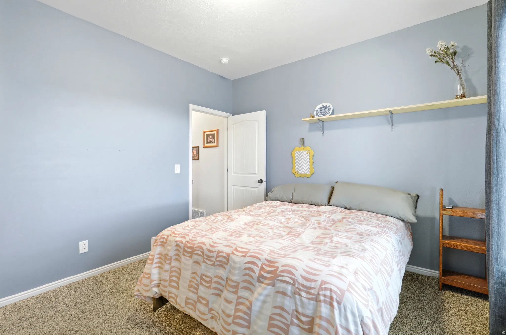 Bedroom featuring carpet flooring